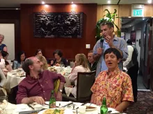 Ethan Bier speaking Ed Giniger and Liqun Luo in foreground  